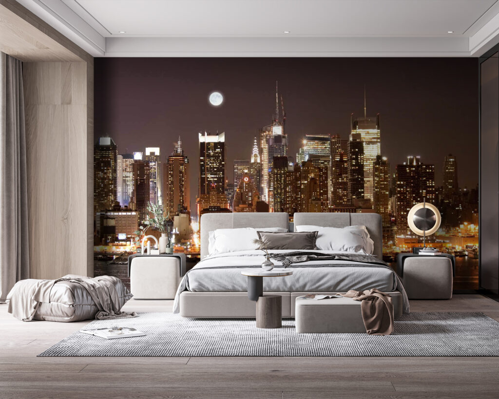 City skyline at night with the moon in the sky