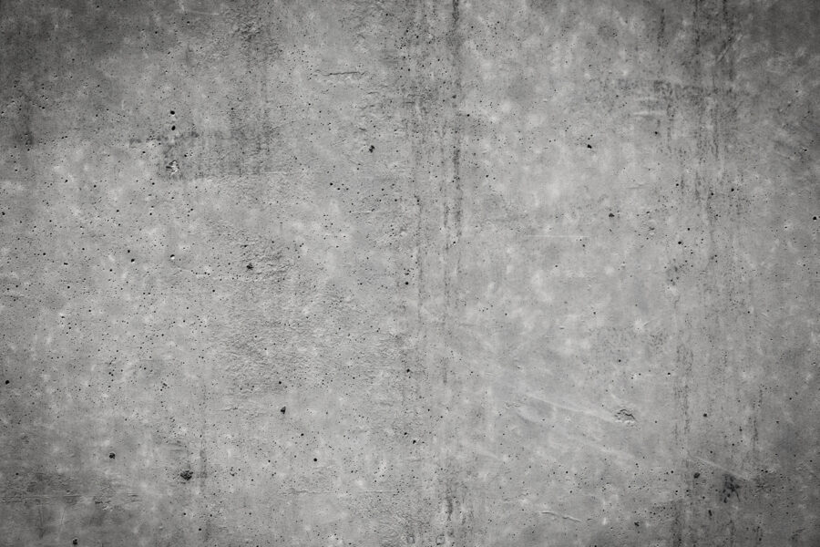 Perete de beton gri cu pete negre Perete de beton gri cu pete negre