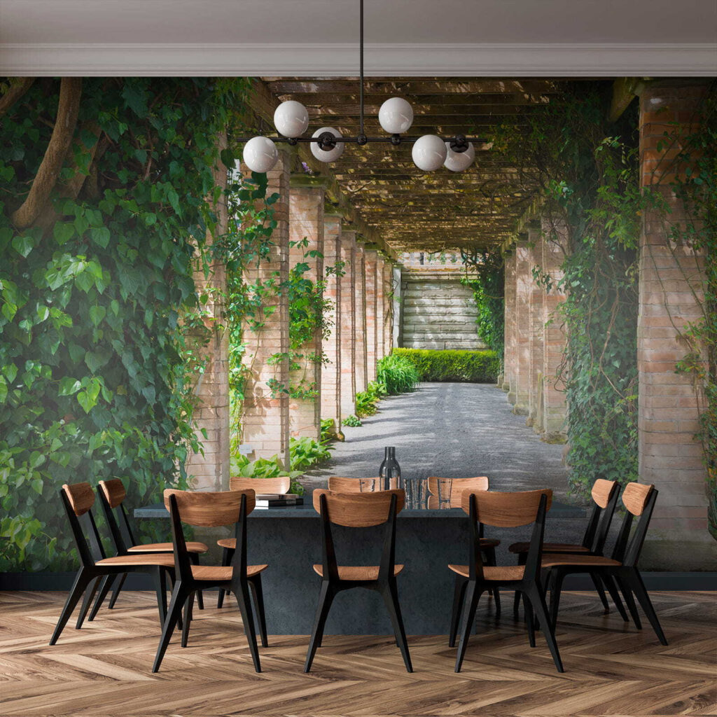 Walkway with stone pillars and vines