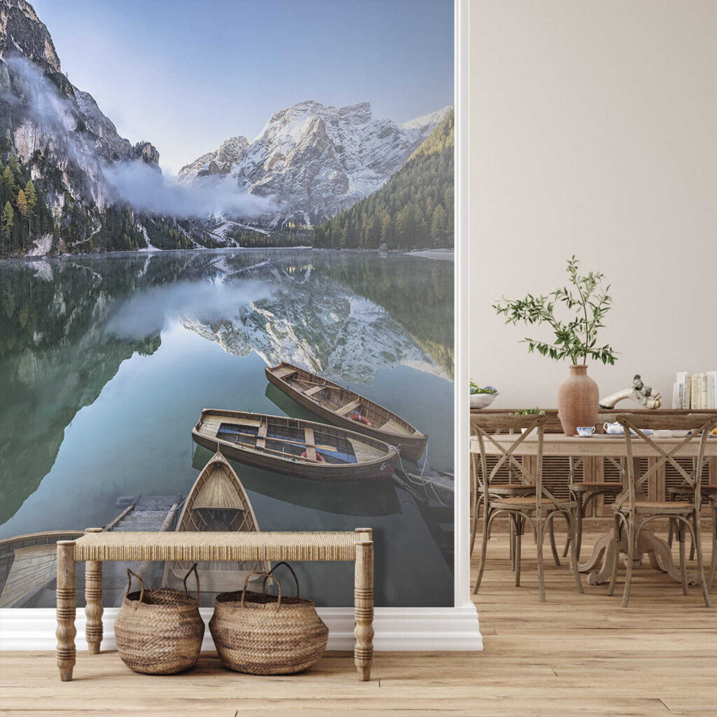 Boats on a lake with mountains in the background