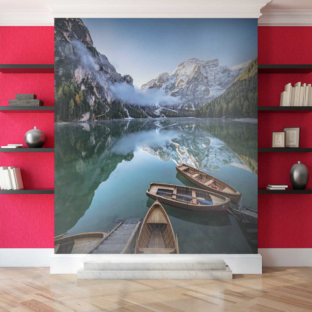 Boats on a lake with mountains in the background