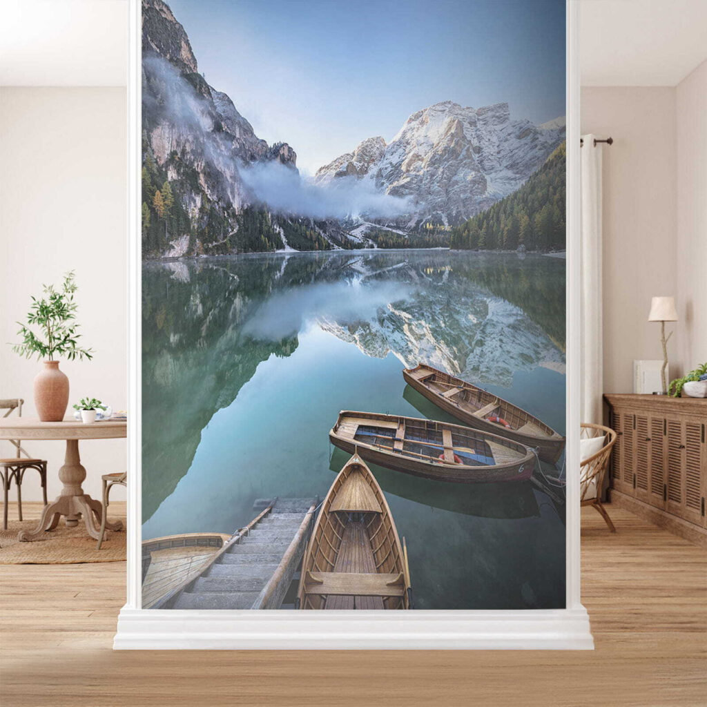 Boats on a lake with mountains in the background