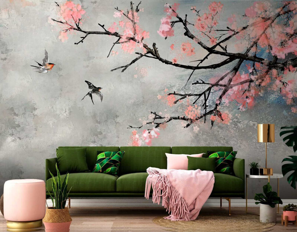 Tree branch with pink flowers and birds flying