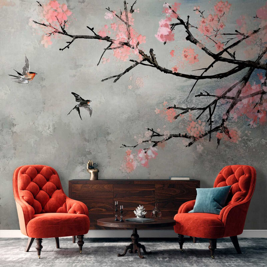 Tree branch with pink flowers and birds flying