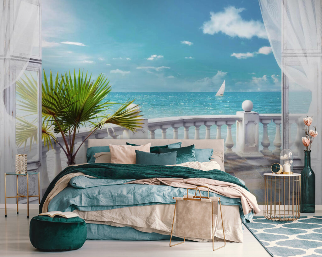 Balcony with a palm tree and a sailboat in the water