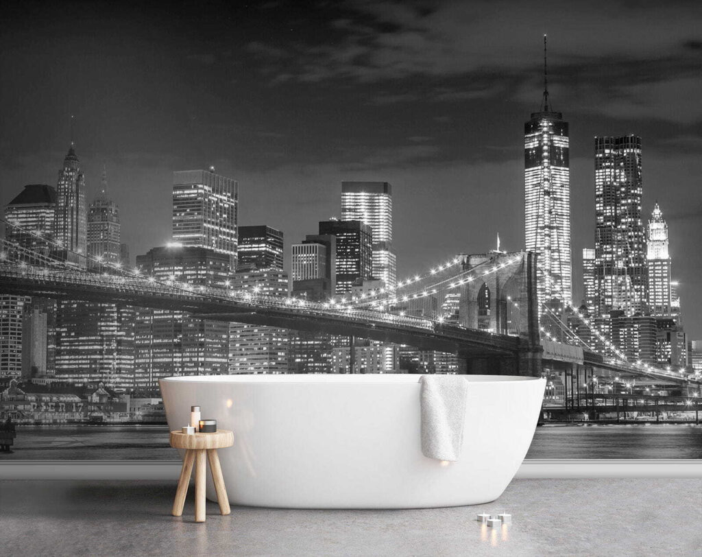 Bridge over water with city skyline at night