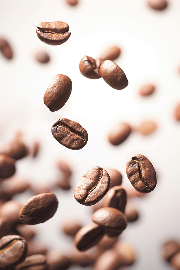 Coffee beans falling in the air Coffee beans falling in the air