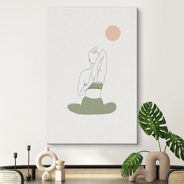 O femeie așezată în poziția yoga O femeie așezată în poziția yoga