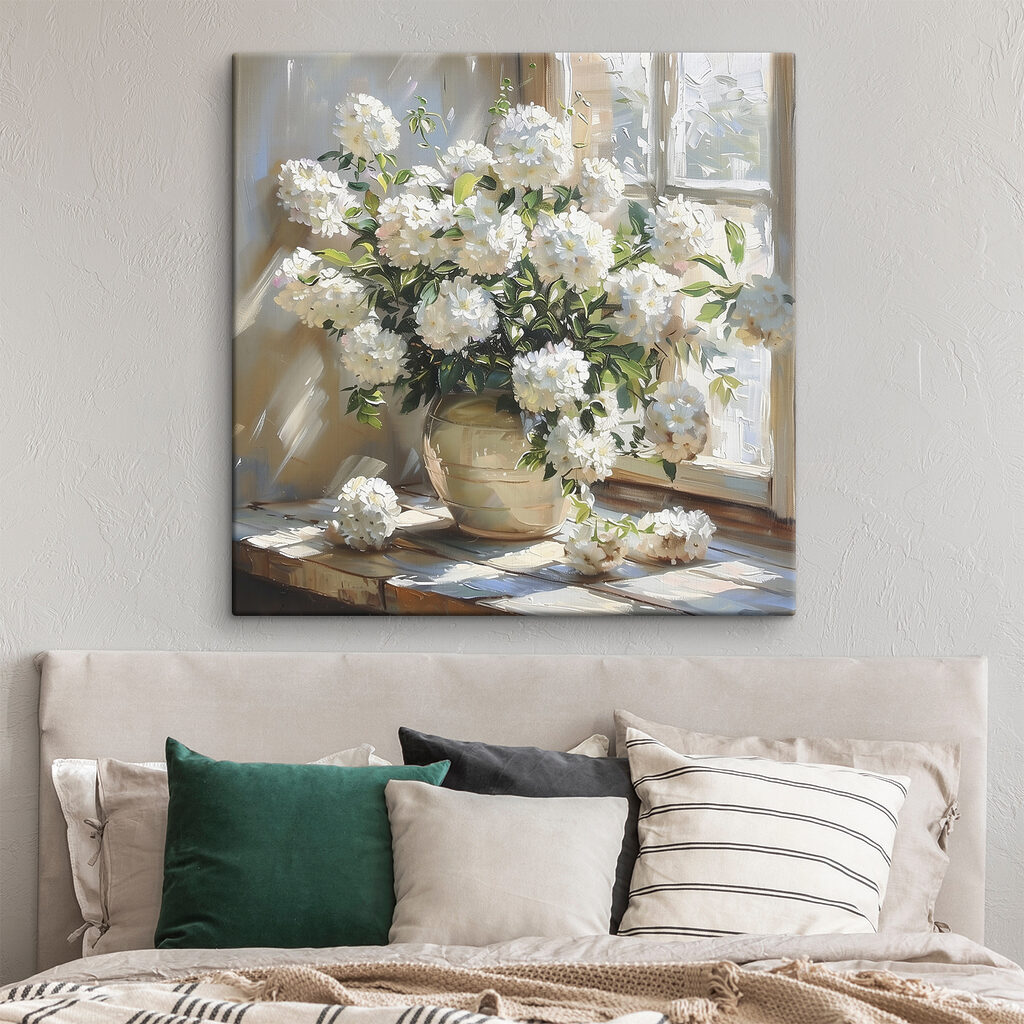 Vase of white flowers in front of a window