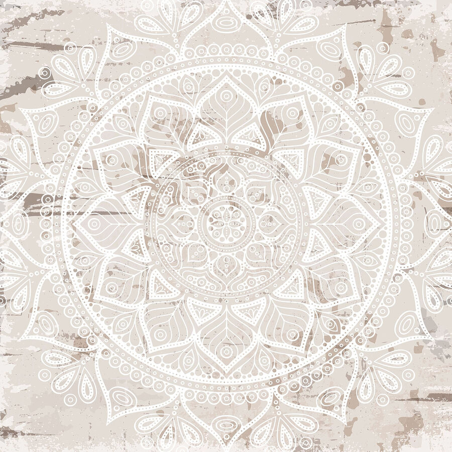 Mandala albă pe o suprafață maro