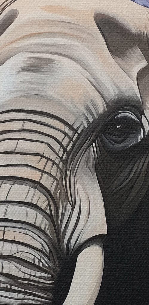 An elephant with tusks in a flower garden An elephant with tusks in a flower garden