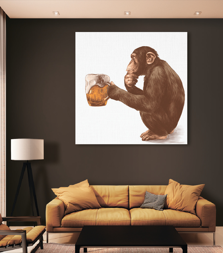 Monkey holding a mug of beer