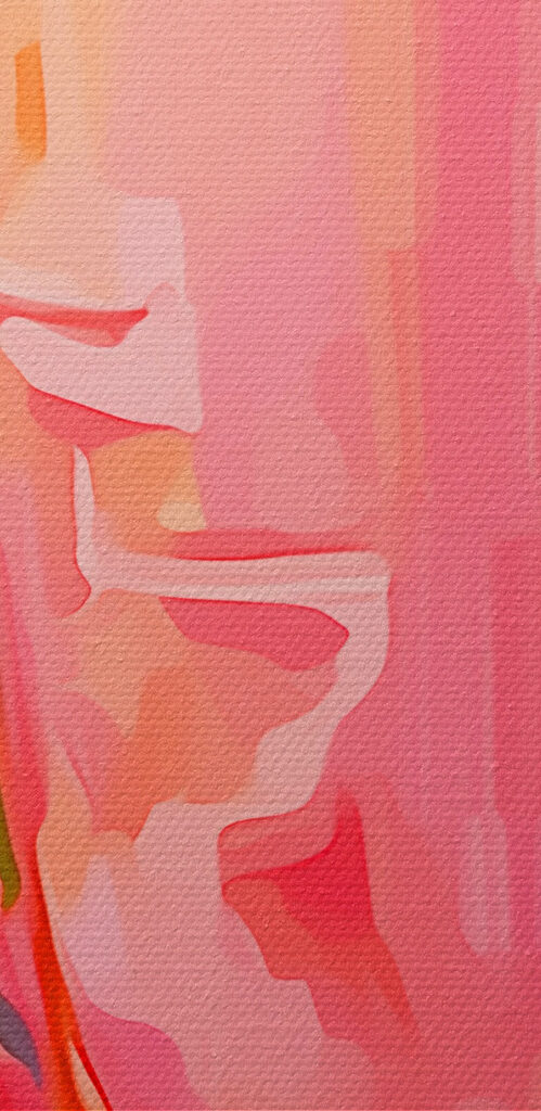 Glass of pink liquid with lemons and flowers