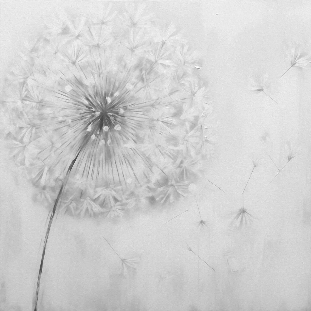 Dandelion flower with seeds flying in the air