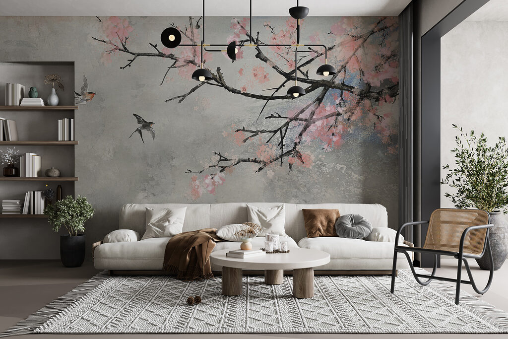 Tree branch with pink flowers and birds flying