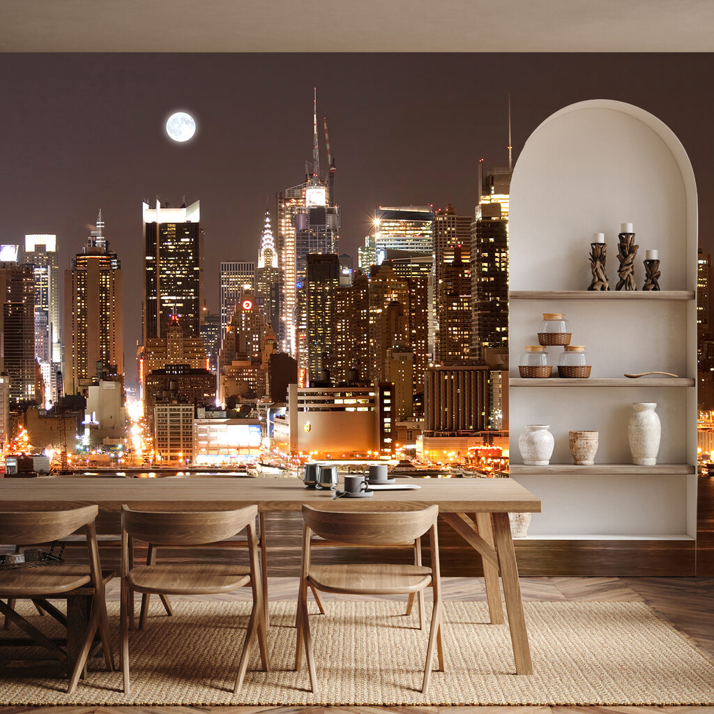 City skyline at night with the moon in the sky