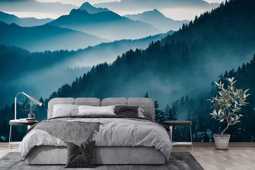 Mountain range with trees and fog