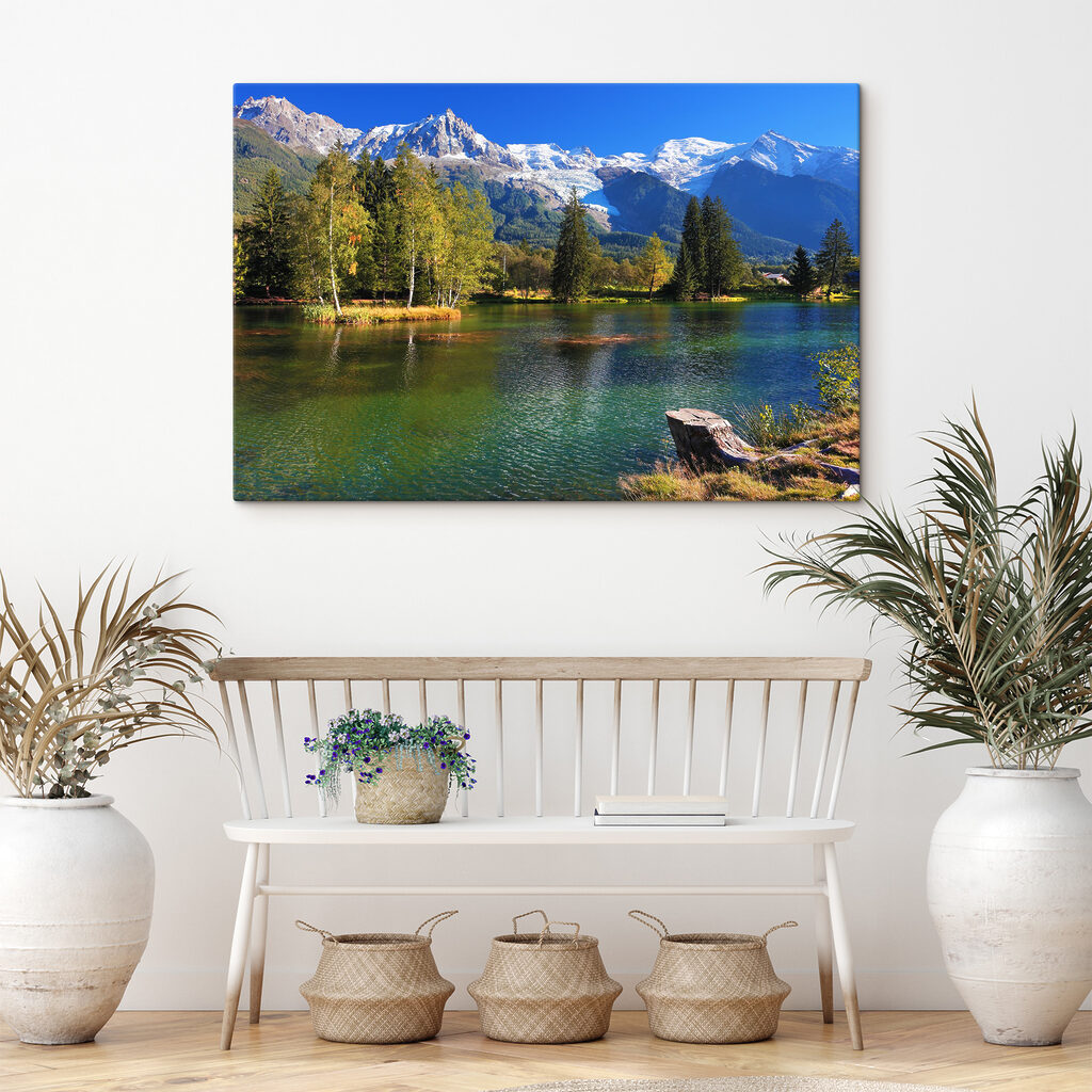 A lake surrounded by trees and mountains