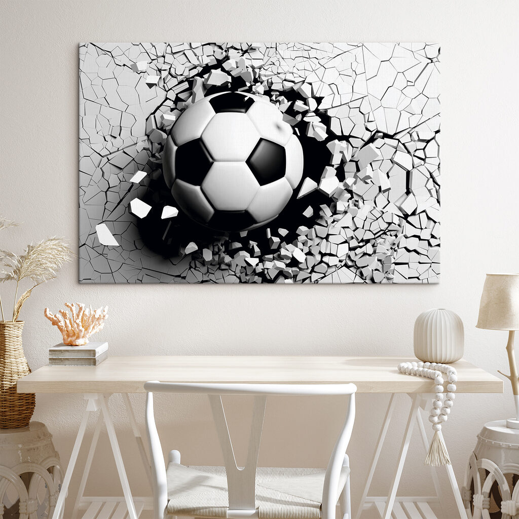 A football ball breaking through a wall