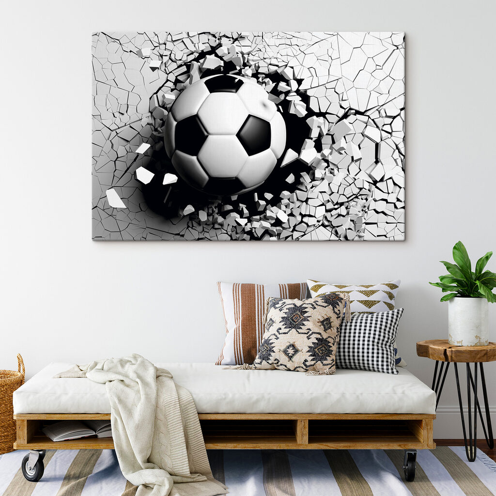 A football ball breaking through a wall