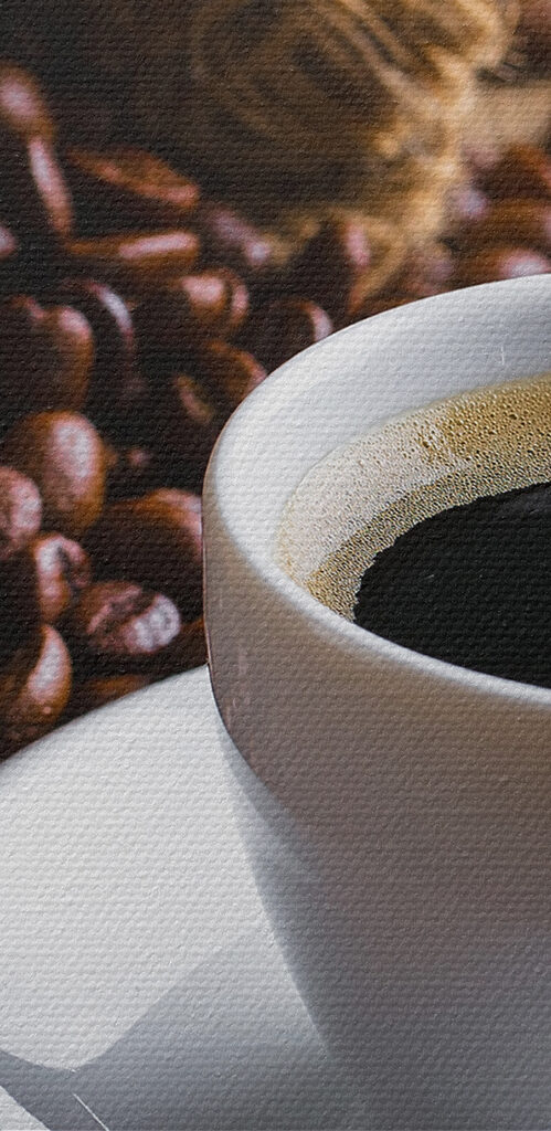 A cup of coffee and a bag of coffee beans