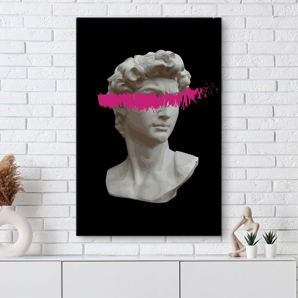 A statue of a man with a pink line