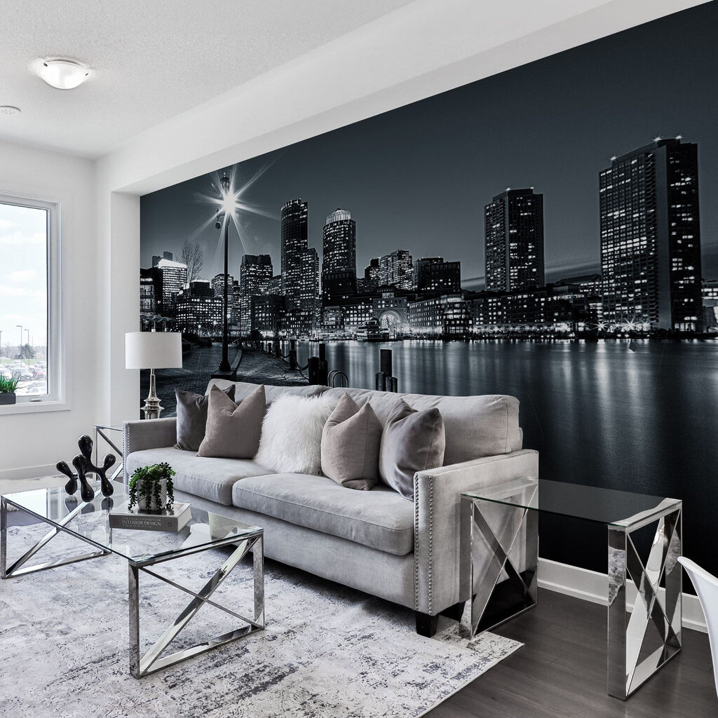 A city skyline with lights on the water