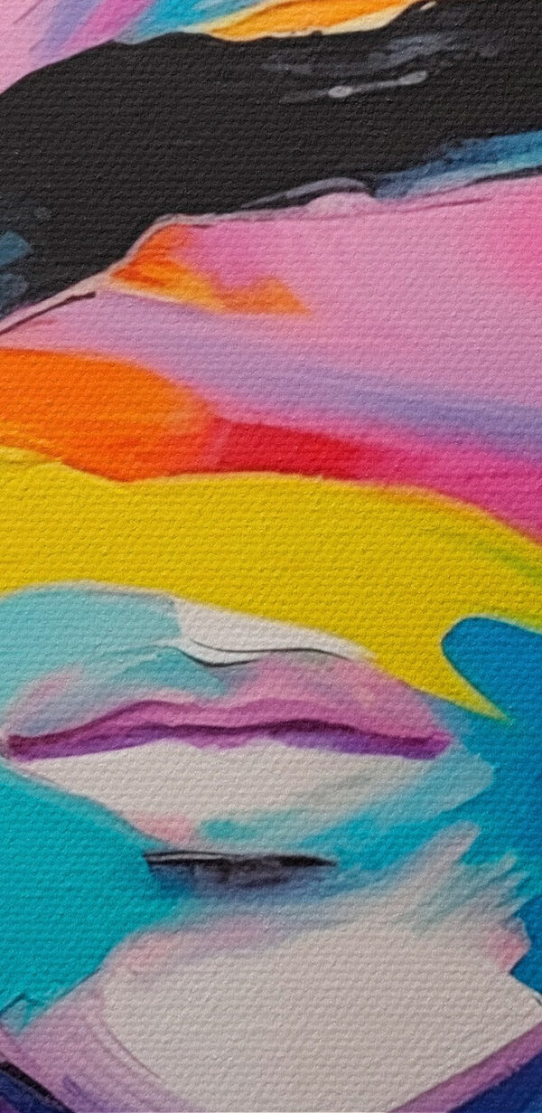 Pictura de o femeie cu vopsea colorată pe fata ei Pictura de o femeie cu vopsea colorată pe fata ei