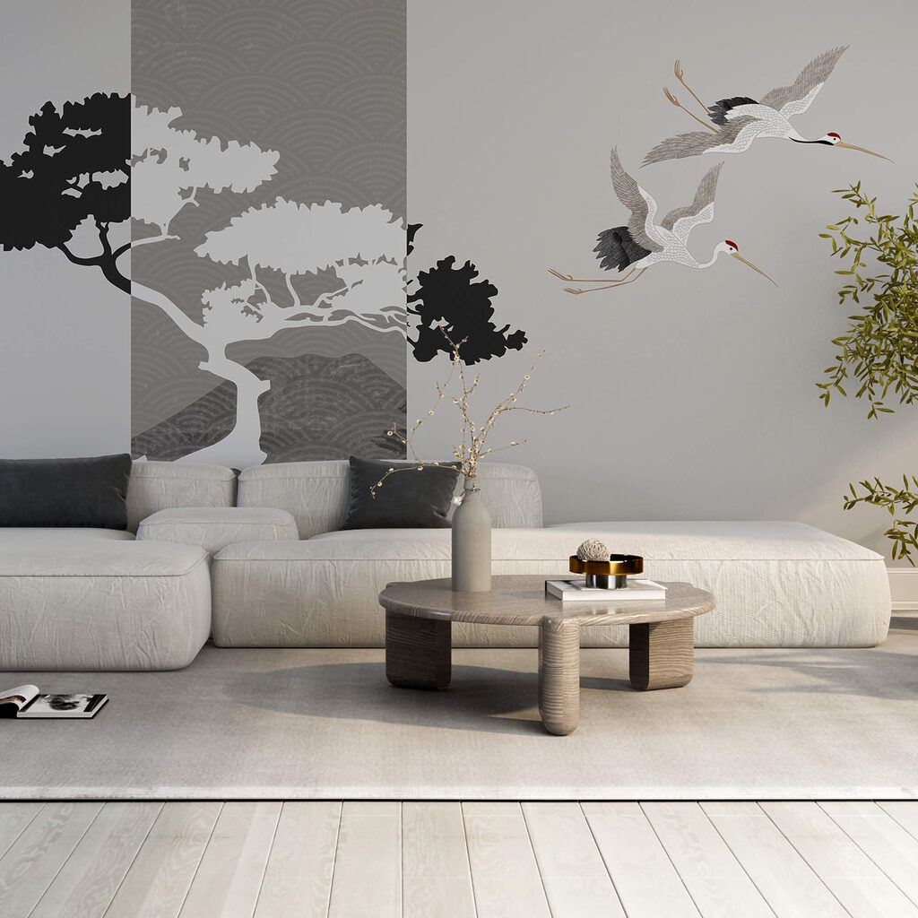 Cuplu de cocori care zboară lângă un copac