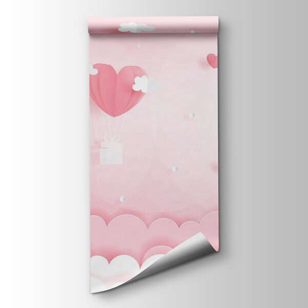 Pink paper cutout of hot air balloons and clouds