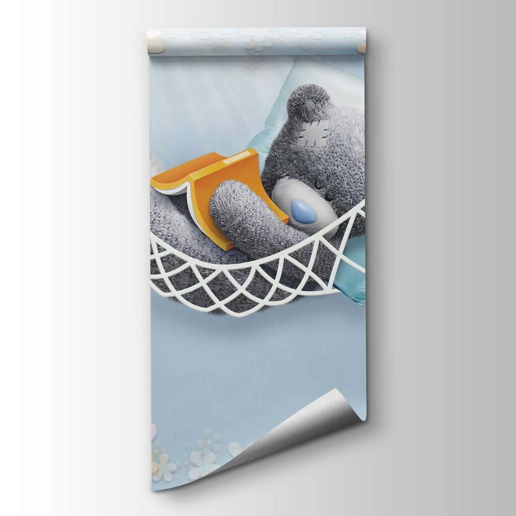 Teddy bear sleeping in a hammock