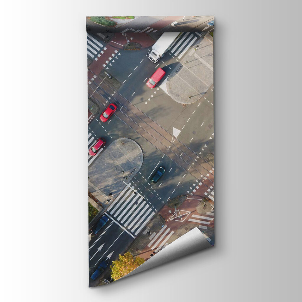 Aerial view of a street intersection with cars and buildings Aerial view of a street intersection with cars and buildings