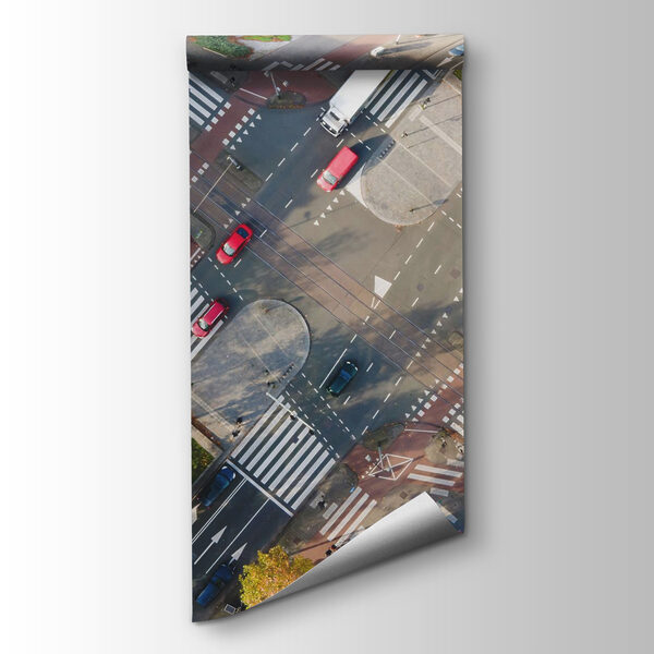 Aerial view of a street intersection with cars and buildings Aerial view of a street intersection with cars and buildings