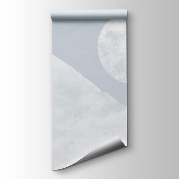 Moon over a snowy mountain