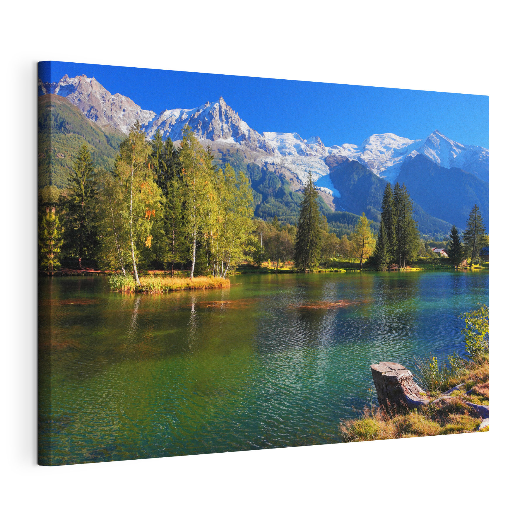 A lake surrounded by trees and mountains A lake surrounded by trees and mountains