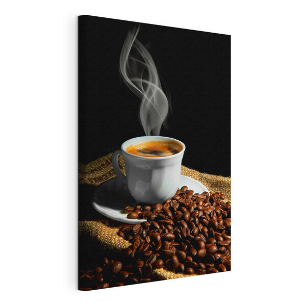 A cup of coffee with smoke on a saucer and beans