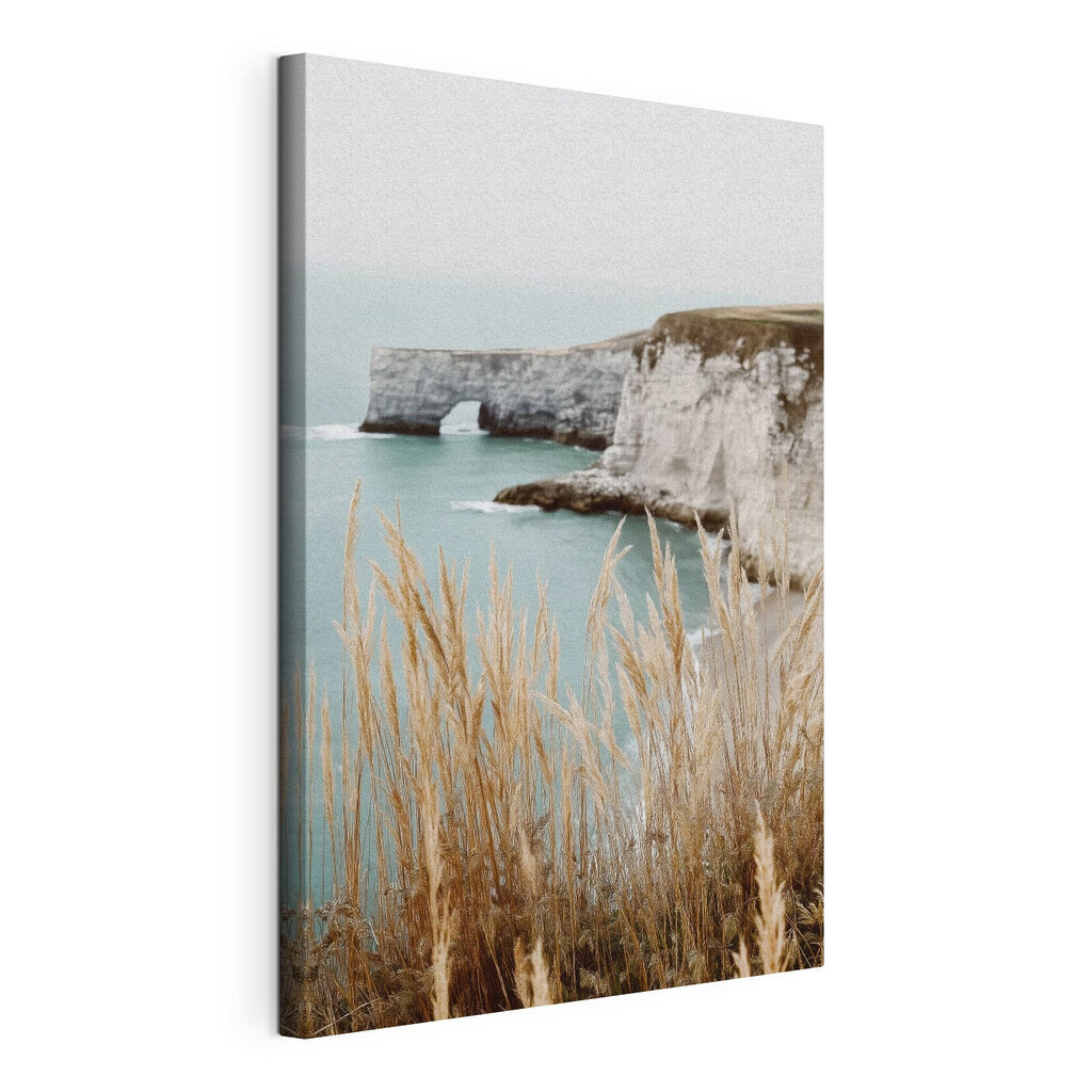 Tall grass next to a body of water