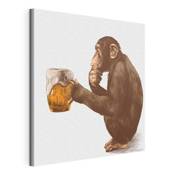 Monkey holding a mug of beer