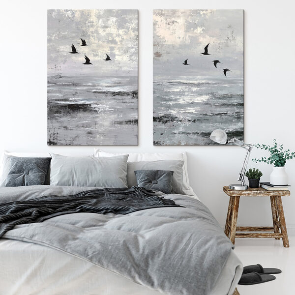 Group of birds flying over water
